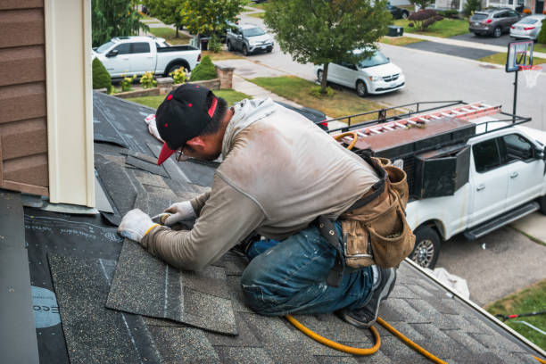 Professional Roofing technician working in Rock, WV